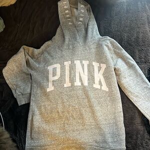 A pink sweatshirt with pockets size small